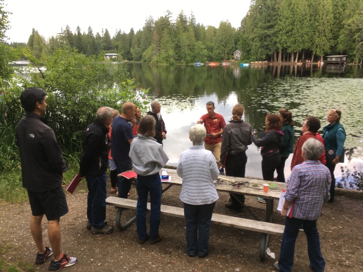 People learning how to look for aquatic weeds at Beaver Lake.